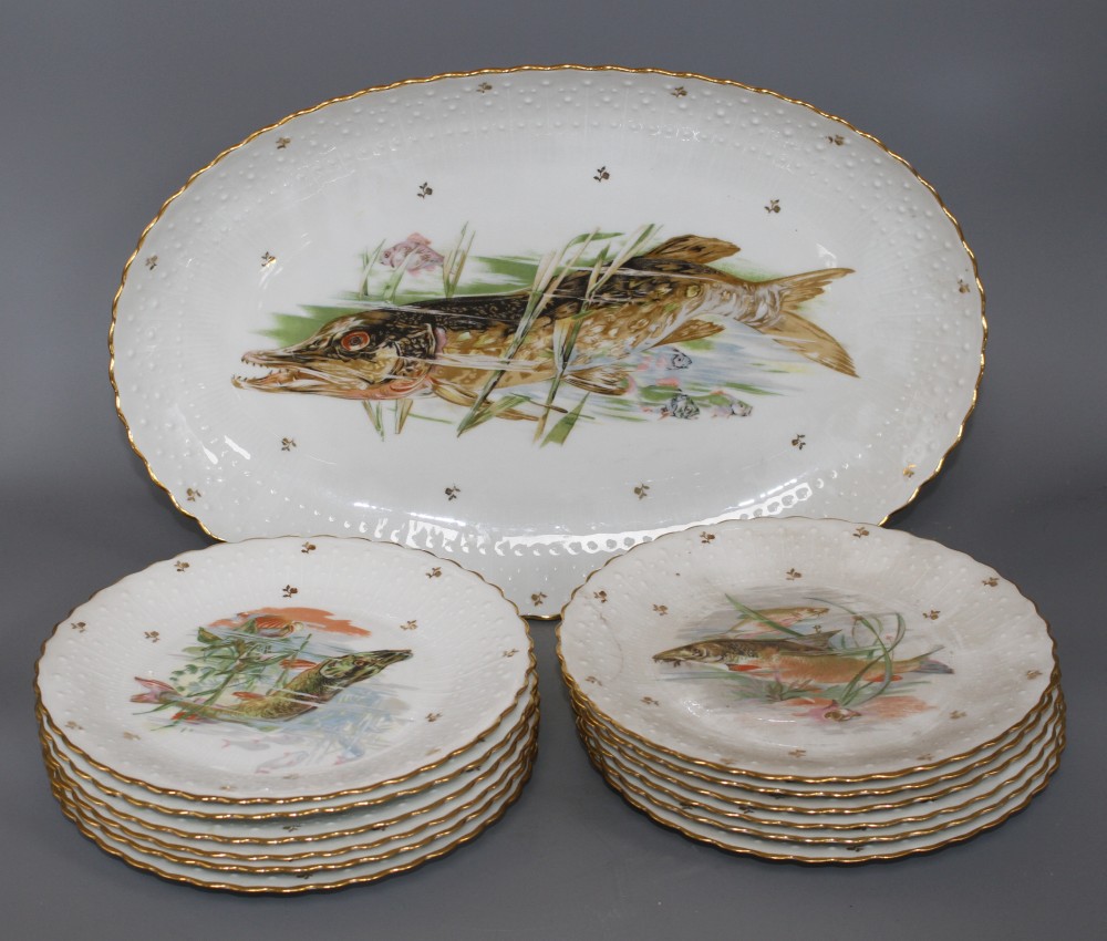 A Limoges thirteen piece porcelain fish service, printed with pike and other freshwater fish